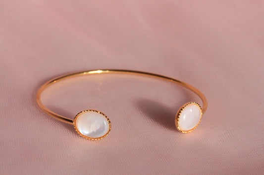 Bangle bracelet with two natural mother-of-pearl stones gilded with fine gold