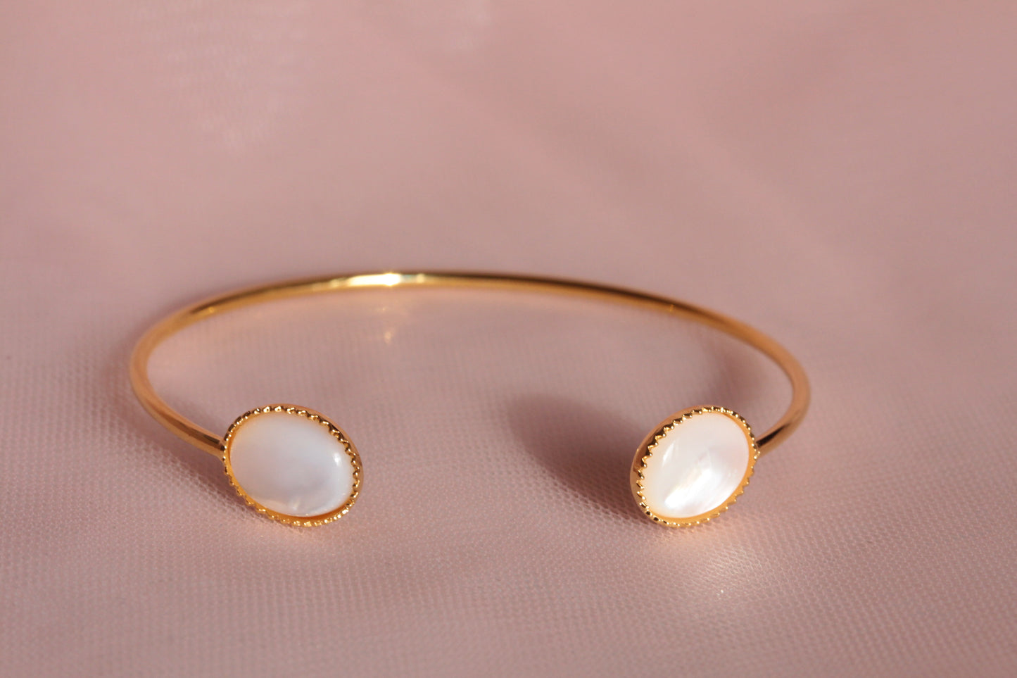 Bangle bracelet with two natural mother-of-pearl stones gilded with fine gold