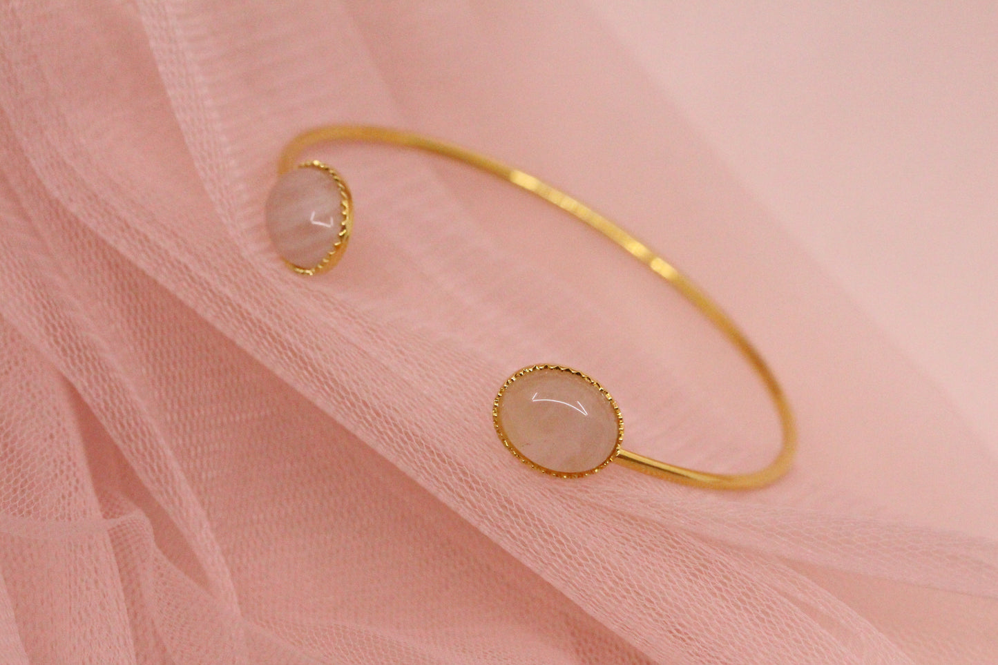 Bangle bracelet with two natural mother-of-pearl stones gilded with fine gold