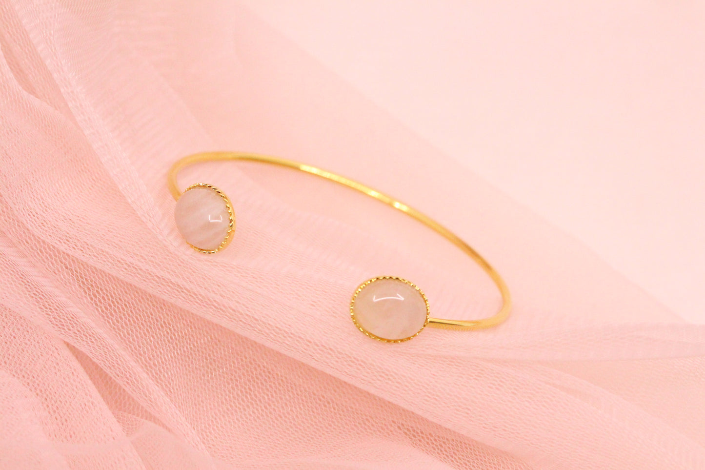 Bangle bracelet with two natural mother-of-pearl stones gilded with fine gold